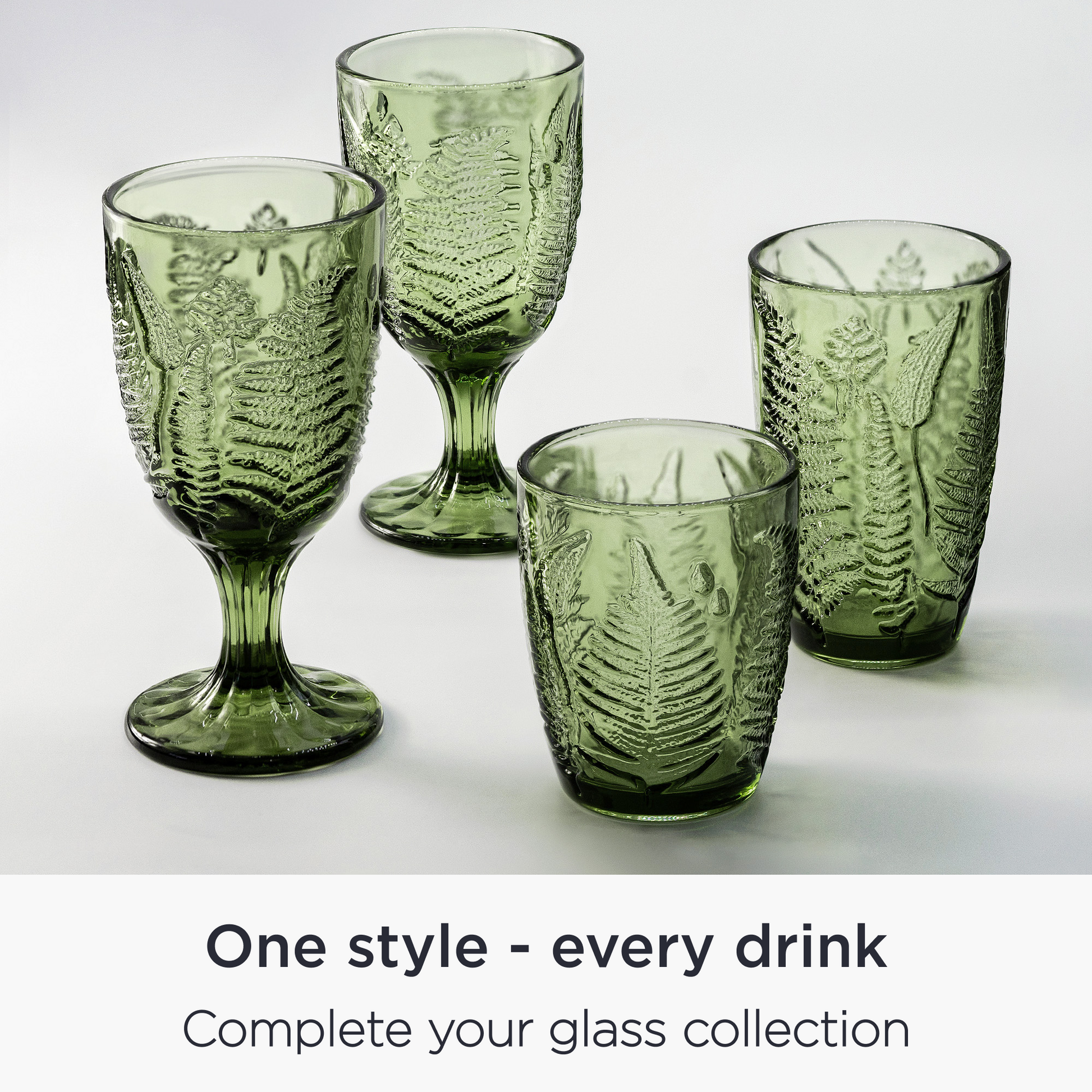 hand-blown green goblets with antique textured floral pattern